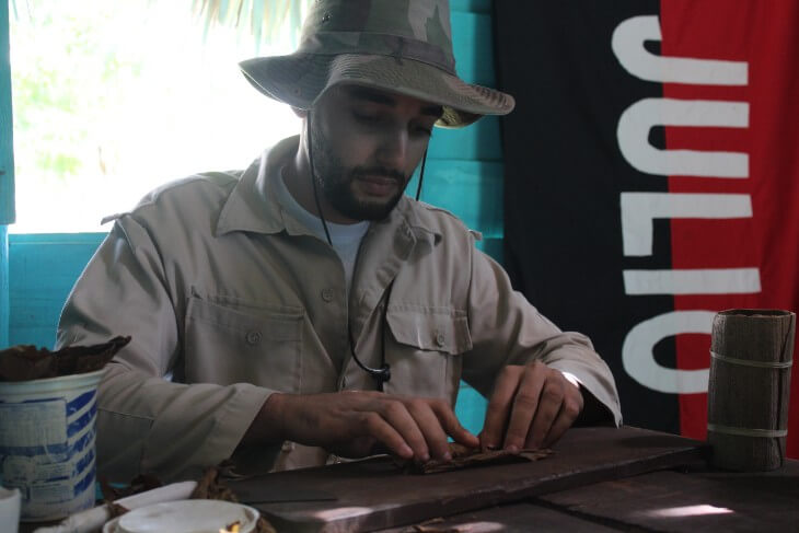 Farmer rolling a cigar